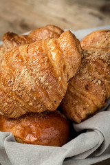 freshly baked buns with almonds. Croissants and brioches