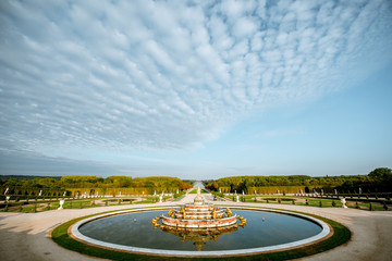 Versailles gardens with Latona fountain and Grand canal during the morning light in Versailles,...