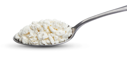 Cottage cheese in spoon isolated on white background