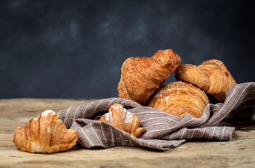 freshly baked buns with almonds. Croissants and brioches