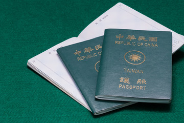 Taiwanese passports on green table