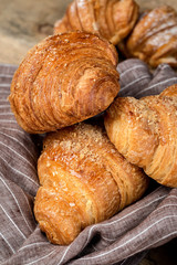freshly baked buns with almonds. Croissants and brioches