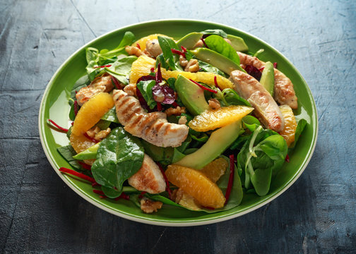 Grilled chicken with orange and avocado salad