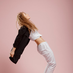 Beautiful young girl Pink background