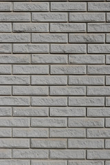 Wall of gray brick imitation granite