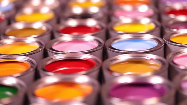Group of tin metal cans with color paint