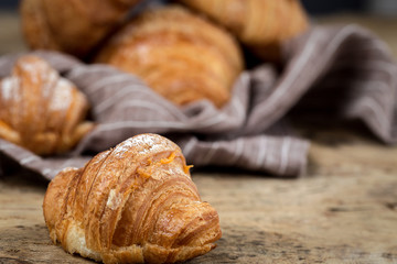 freshly baked buns with almonds. Croissants and brioches