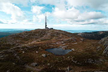 Scenic view of Ulriken Peak in Bergen Norway with Radio Communications Tower overlooking Horizon and City
