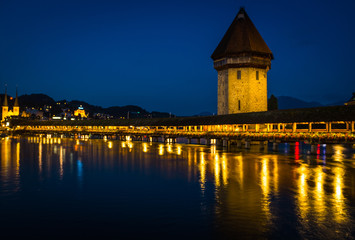 Fototapeta na wymiar View of Chapel Bridge in Lake Lucerne at Night