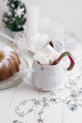 Marshmallow in a cup of hot beverage. cup with marshmallows and Christmas candy
