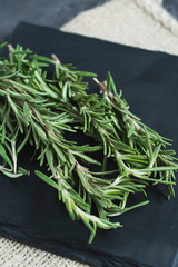 Close up of rosemary on a slate tray. 