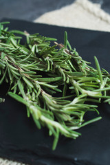 Close up of rosemary on a slate tray. 