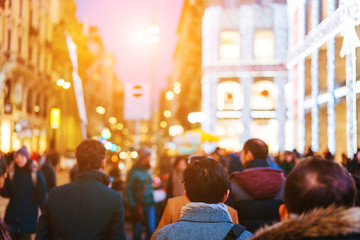people crowd walking on busy street