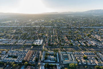 Aerial sunset view towards Sepulveda Blvd and the 405 freeway in the North Hills area of the San Fernando Valley in the City of Los Angeles, California. 