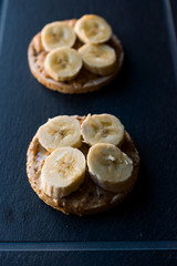 Bulgur Rice Cakes with Sliced Bananas and Peanut Butter / Round Crackers.
