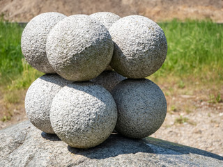 Stone balls on rock pedestal