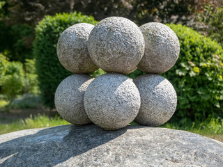 Fototapeta na wymiar Stone balls on rock pedestal