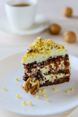 Slice of carrot cake on a wooden table