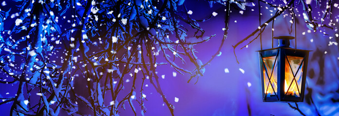 Winter Background with a Christmas Lantern.