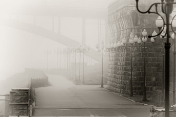 Morning fog over the houses in a small town Rybinsk