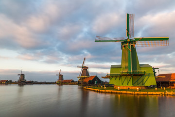 Fototapeta na wymiar Well-preserved historic windmills in Zaanse Schans near Zaandam