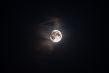 Full moon in a light haze.