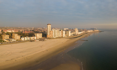 Vlissingen promenade, beach and coastline skyscrapers on sunset