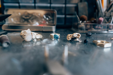 Different jewelery on the table from the jeweler from a close angle
