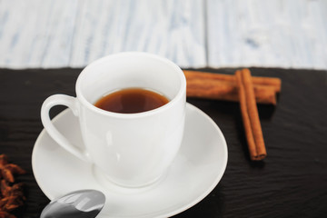 hot coffe on black slate square stone