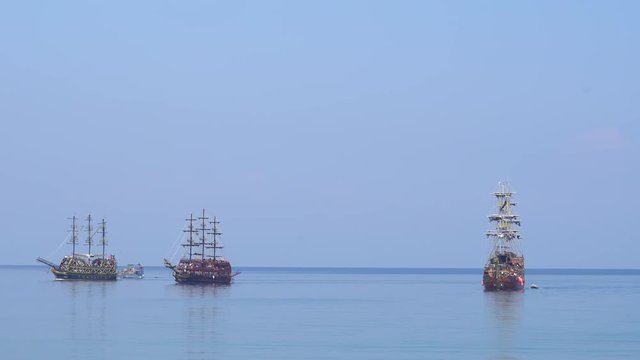 Tour Boats Cruising Into Mediterranean Sea. Aerial Shot From Kemer Fortress