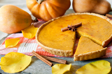 Homemade spicy pumpkin pie with cinnamon