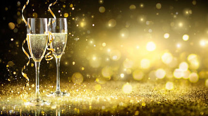 Champagne Flutes In Golden Sparkle Background - Happy New Year
