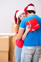 Young family celebrating christmas in new home