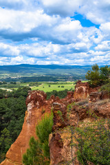 Fototapeta na wymiar Ochre cliffs and rock formations near the village of Roussillon in the Luberon area of Provence, France