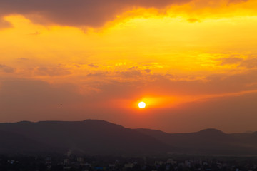 Beautiful landscape with distant hills and the colorful sky