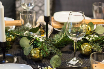 Table served for Christmas dinner in living room, close up view