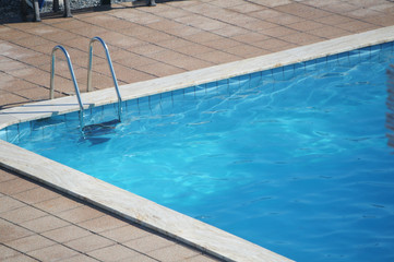 Fototapeta na wymiar ladder of a swimming pool