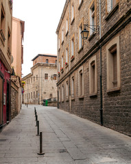 Paved street of old houses and lamps in the Spanish city of Vitoria