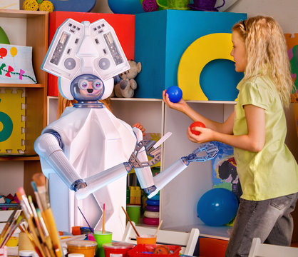 Child training of artificial intelligence by robot. Day care replace teachers facilities test robots for kid. Physical education of little girls playing with animator machine assistant.
