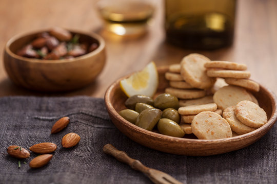 Crackers, almonds, wine, set for a party