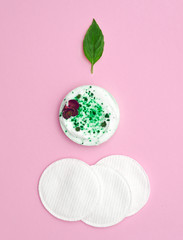 Jar of cream on pink background. Composition of Сhristmas tree from cosmetics close-up.  Flat lay.