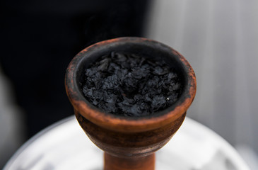 Tobacco for hookah in a clay bowl for shisha smoke.