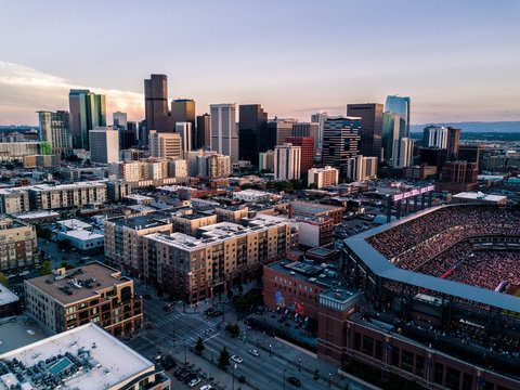 Aerial drone photo of the city of Denver skyline at sunset