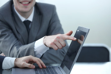 close up.young businessman pointing at laptop screen