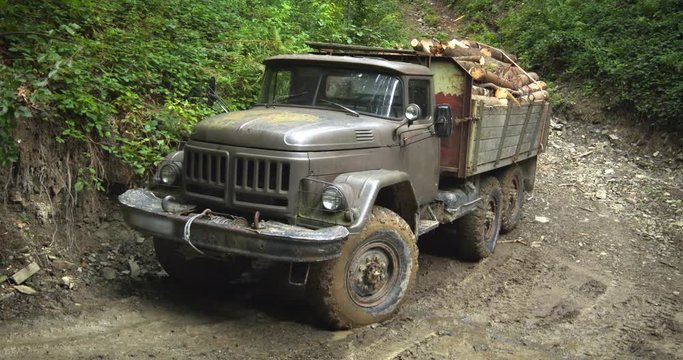 Surplus Russian Army Truck Loaded with Logs in Ukrainian Forest