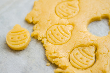 Raw dough for christmas cookies for children, making gingerbread in form of ball close-up. New year treat for Santa Claus cooking. Homemade bakery, xmas sweet, winter holidays concept