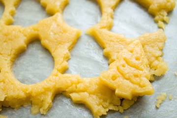 Raw dough for christmas cookies for children, making gingerbread in form of fir tree close-up. Recipe of New year treat. Homemade bakery, xmas sweet, winter holidays concept