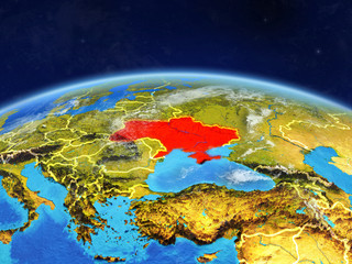 Ukraine on planet Earth with country borders and highly detailed planet surface and clouds.