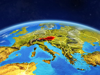 Austria on planet Earth with country borders and highly detailed planet surface and clouds.