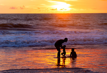 Father with children at beach
